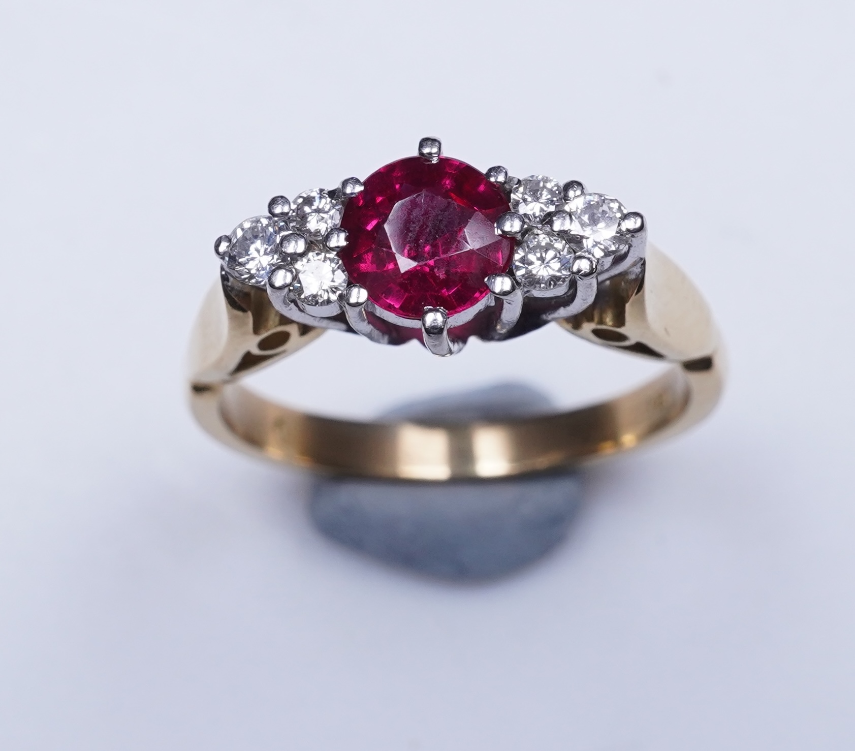 A synthetic ruby and diamond ring